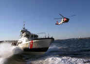 A USCG 47-foot motor lifeboat and a HH-60 Jayhawk helicopter. -- Photo: US Coast Guard