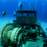 The PADI Wreck Diver Course | Whether sunk on purpose as an artificial reef or the result of mishap, wrecks open fascinating windows to the past. Most divers find wrecked ships, airplanes and even automobiles nearly irresistible because theyre intriguing to explore, exciting avenues of discovery, and usually teeming with aquatic life. The PADI Wreck Diver course teaches you the ins and outs of rewarding, responsible wreck diving. The fun part of the PADI Wreck Diver course is visiting wrecks, unlocking mysteries and starting to gain the knowledge and experience that allows you to see things that others overlook. Sometimes, only the trained, experienced eye recognizes that a small hole or open door likely caused the vessels demise.