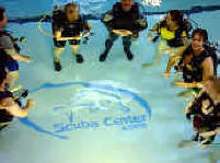 PADI Certification | Beginning Scuba Diving Lessons | PADI Open Water Diver Certificatioin Class enjoying the heated indoor pool at Scuba Center in Eagan, Minnesota. | PADI Open Water Diver Certification classes are small, limited to a maximum of eight to ten students per PADI Instructor during pool (Confined Water) training, to assure personal attention and fun while learning to Scuba dive. | Certification classes offered in Eagan, Minnesota and Minneapolis, Minnesota